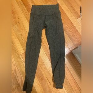 Medium black and army green leggings with pockets.